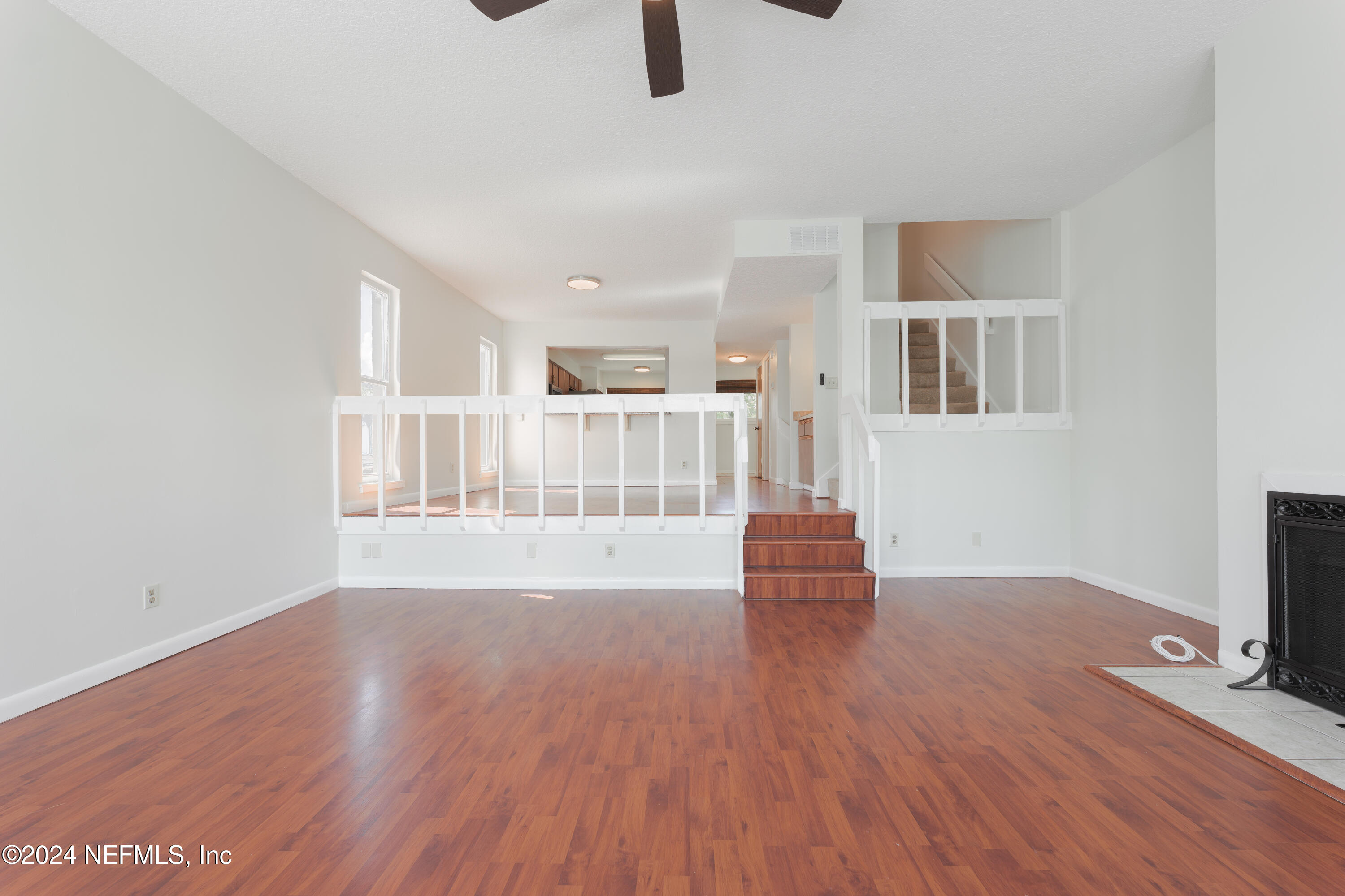 327 Scenic Point Lane Fleming Island, FL 32003 - Photo 22 of 54 wooden floor in an empty room with a window