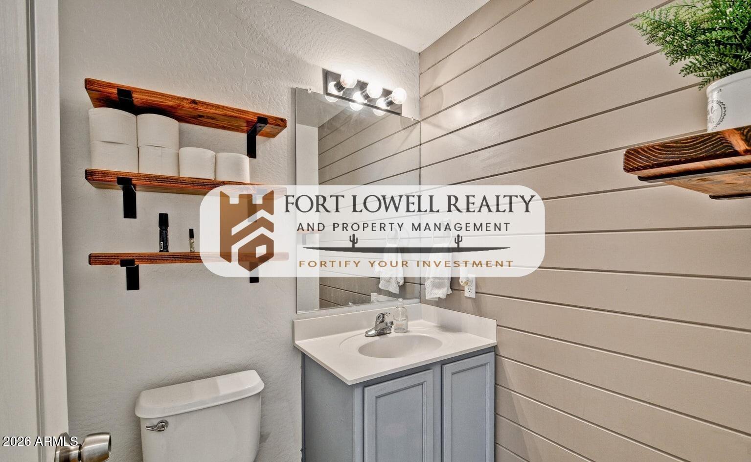 8169 West Groom Creek Road Phoenix, AZ 85043 - Photo 11 of 14 a bathroom with a sink and a toilet