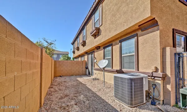a swimming pool with outdoor seating and yard