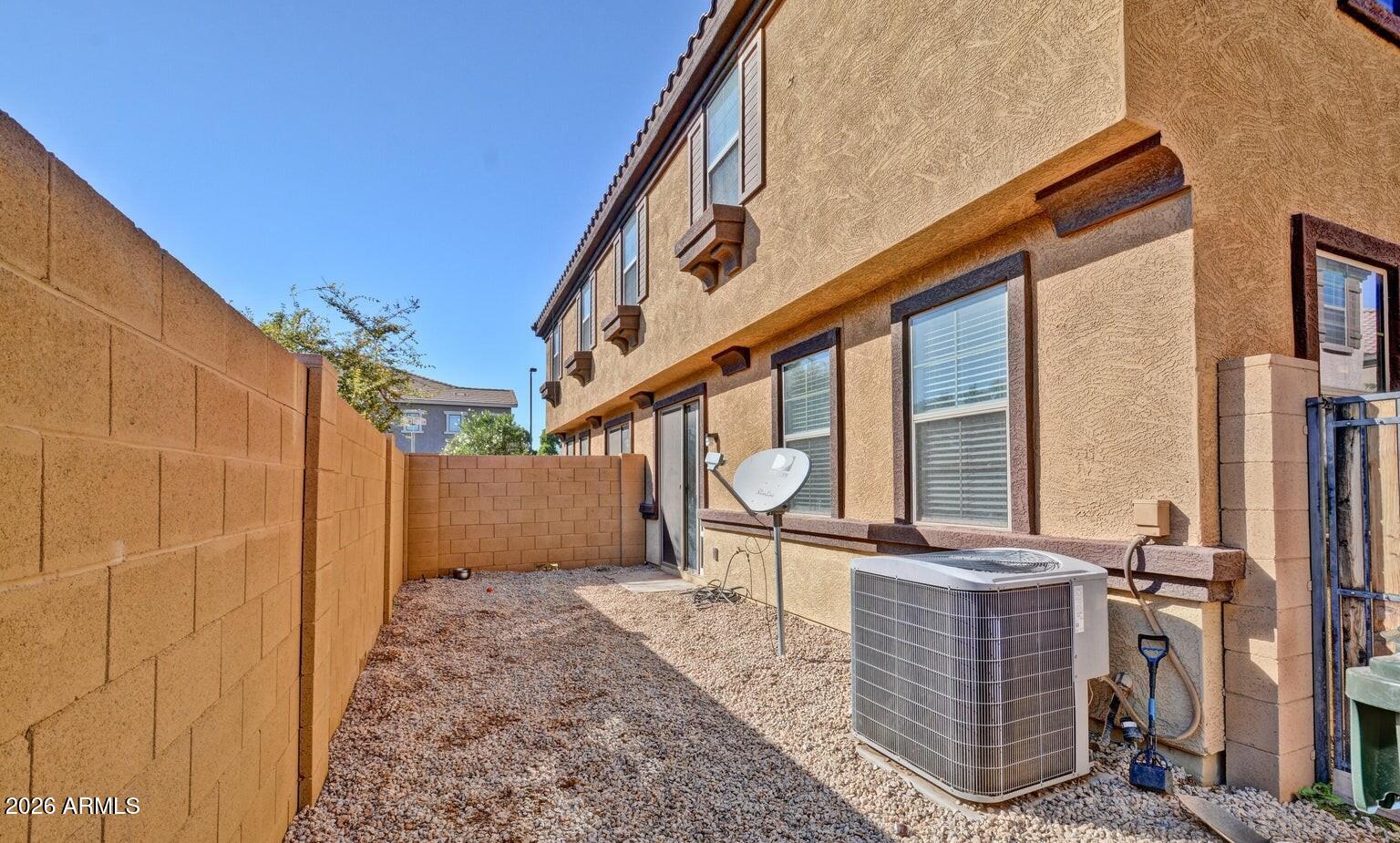 8169 West Groom Creek Road Phoenix, AZ 85043 - Photo 15 of 23 a backyard of a house with barbeque oven table and chairs