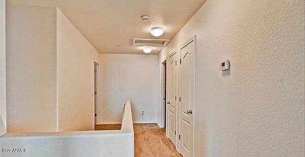8169 West Groom Creek Road Phoenix, AZ 85043 - Photo 19 of 23 a view of a hallway with wooden floor and entryway