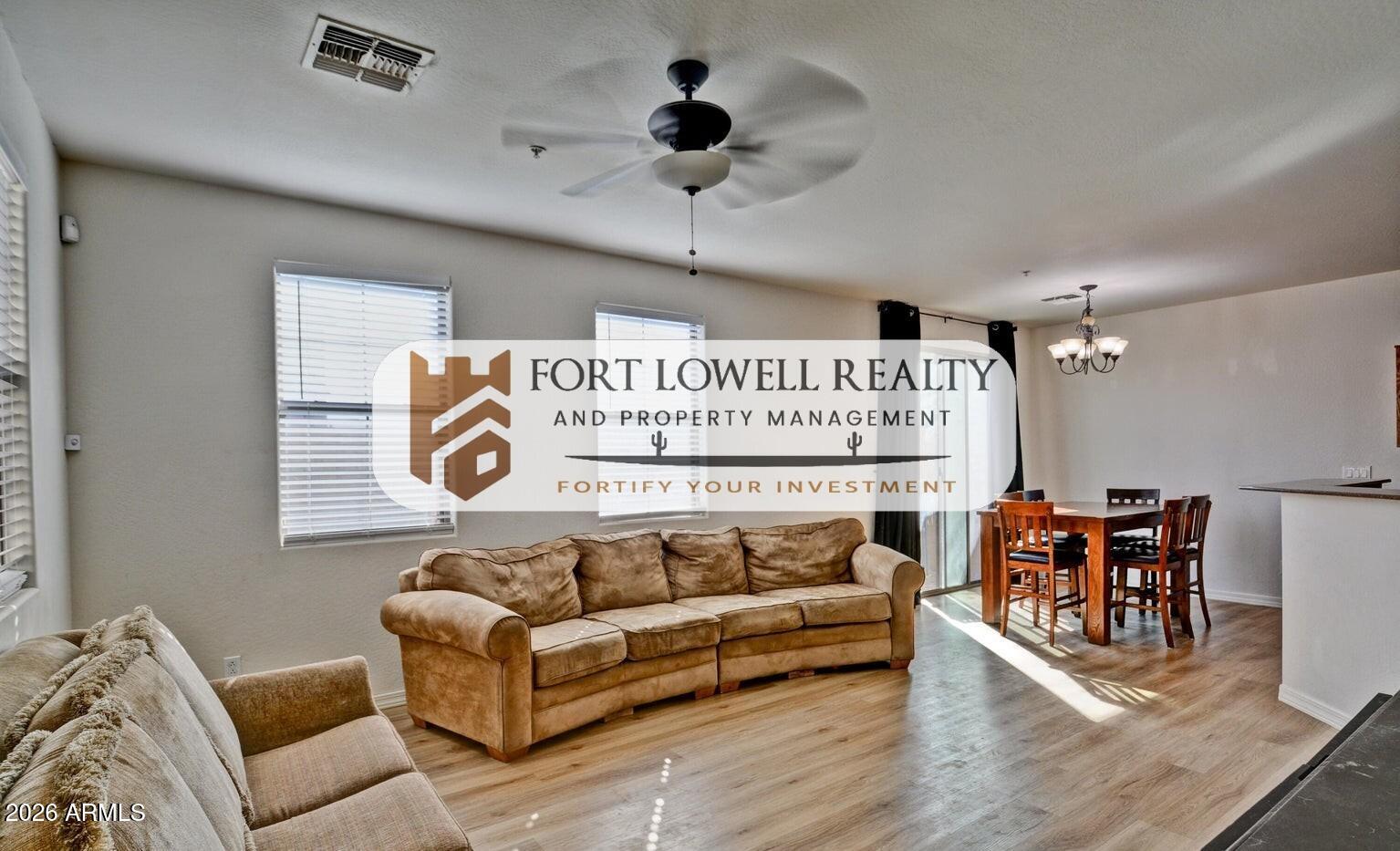 8169 West Groom Creek Road Phoenix, AZ 85043 - Photo 4 of 14 a living room with furniture and a ceiling fan
