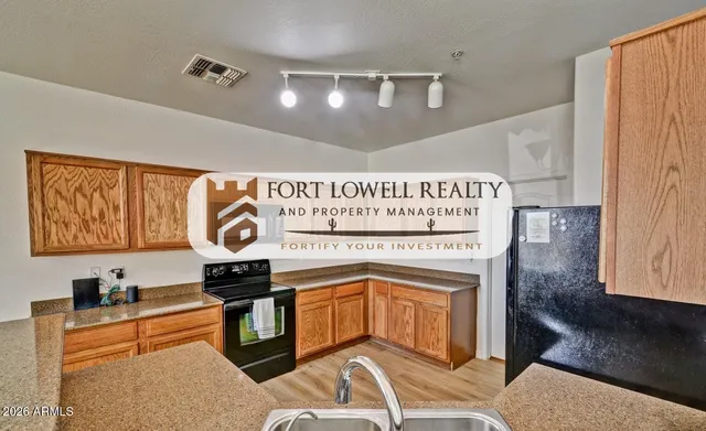 a kitchen with stainless steel appliances granite countertop a stove and cabinets