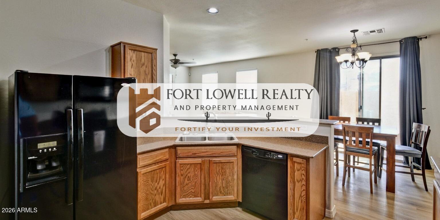 8169 West Groom Creek Road Phoenix, AZ 85043 - Photo 9 of 14 a view of a kitchen with stainless steel appliances granite countertop a stove and a refrigerator