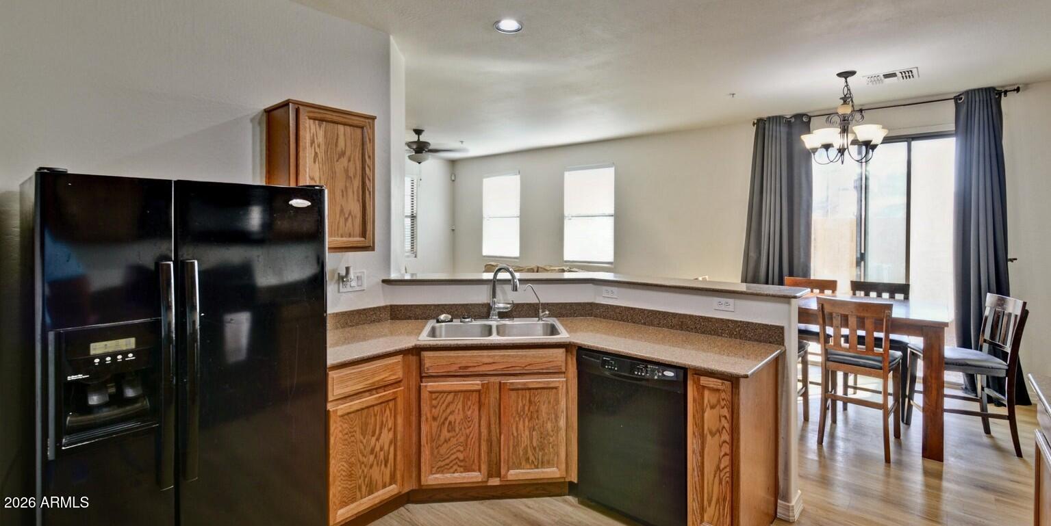 8169 West Groom Creek Road Phoenix, AZ 85043 - Photo 10 of 23 a kitchen with a refrigerator and a sink