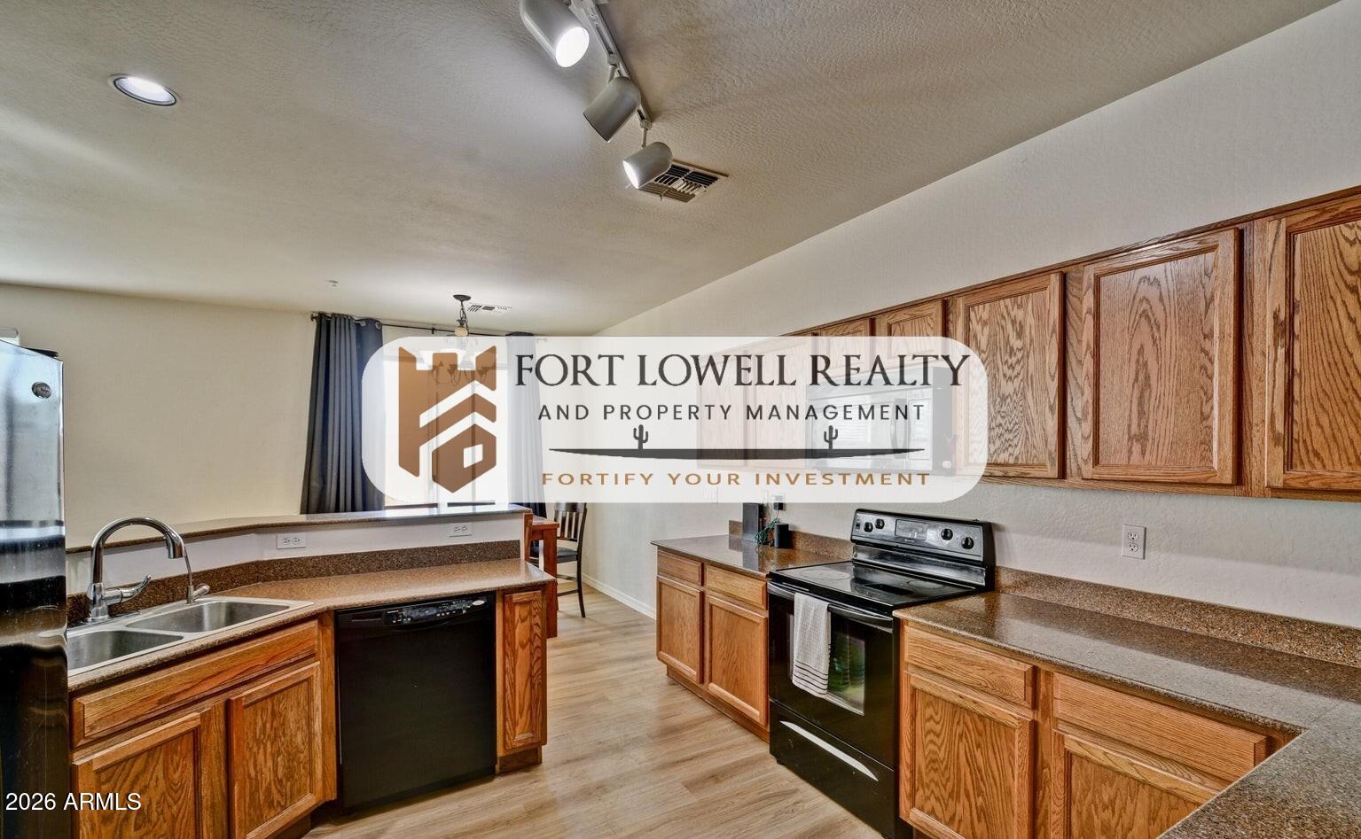 8169 West Groom Creek Road Phoenix, AZ 85043 - Photo 10 of 14 a kitchen with stainless steel appliances granite countertop a stove and a sink