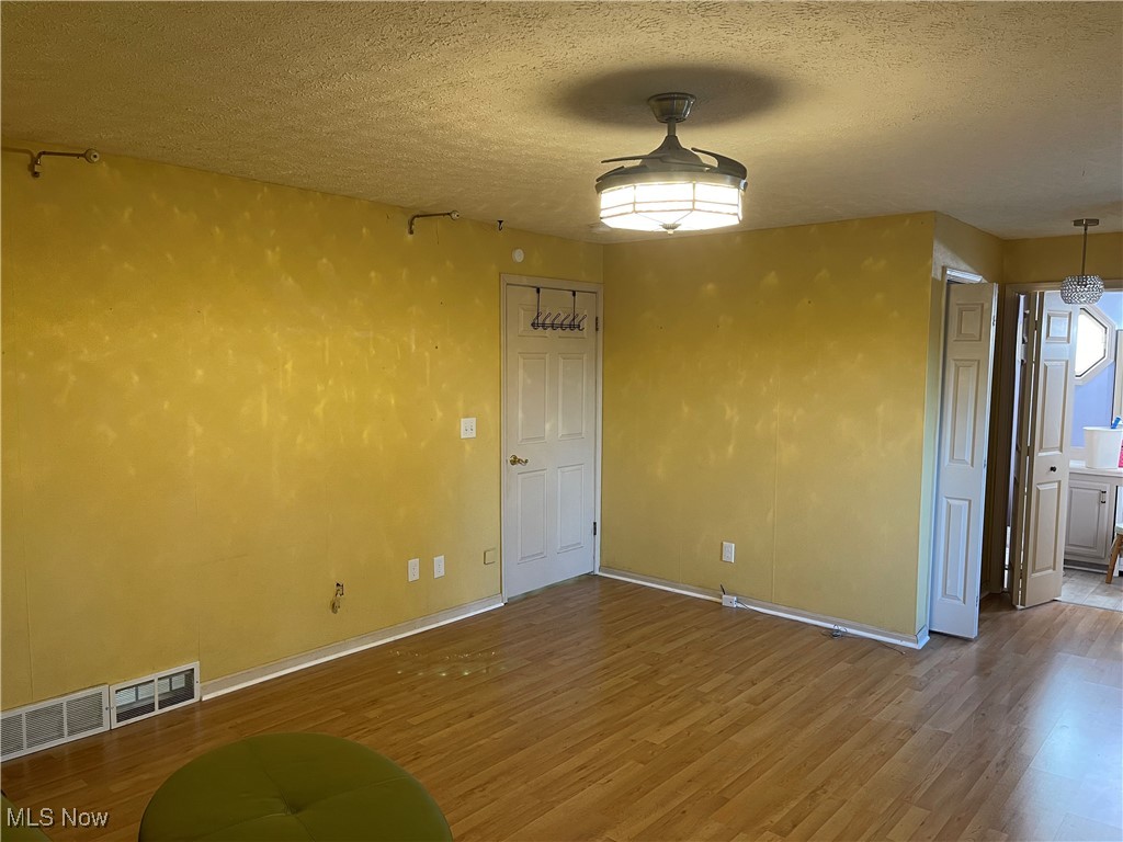 170 Burns Road Elyria, OH 44035 - Photo 8 of 32 Master Bedroom with wood-style LVT flooring