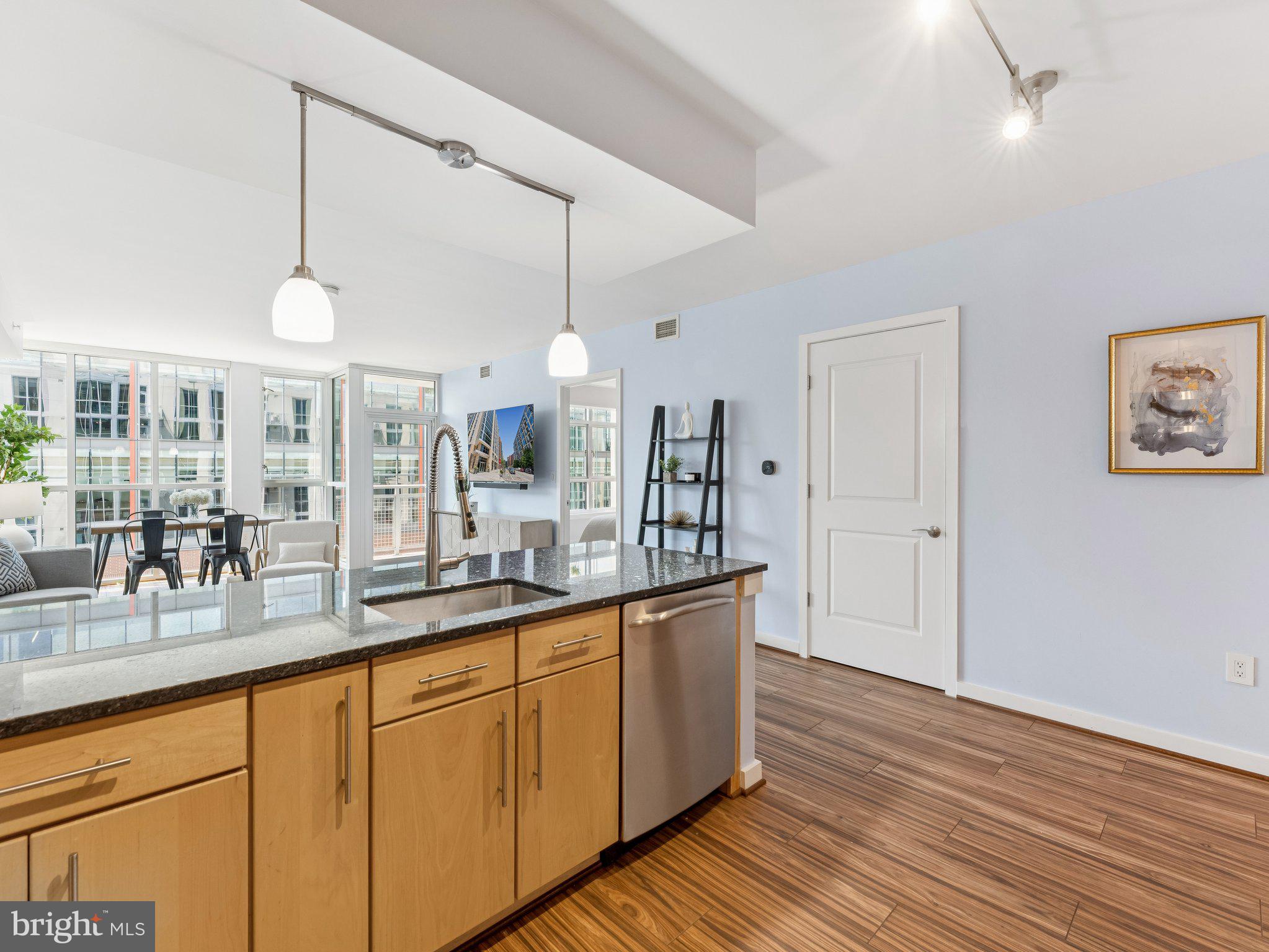 1025 First Street Southeast, Unit 1212 Washington, DC 20003 - Photo 5 of 34 Open plan kitchen overlooks living room