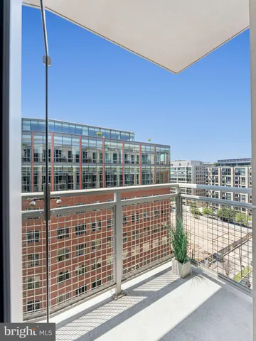 a view of a balcony with a floor to ceiling window