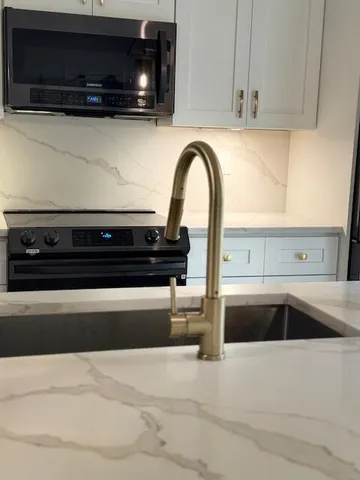 a kitchen with a microwave and cabinets