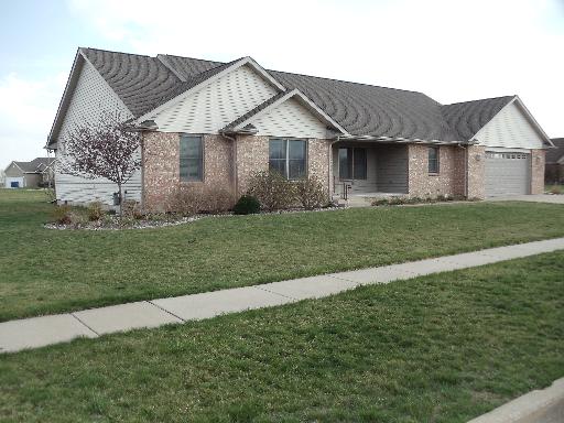 204 Ken Street Dwight, IL 60420 - Photo 1 of 14 a front view of a house with a garden