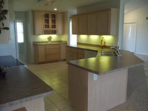204 Ken Street Dwight, IL 60420 - Photo 6 of 14 a kitchen with kitchen island sink and granite counter top