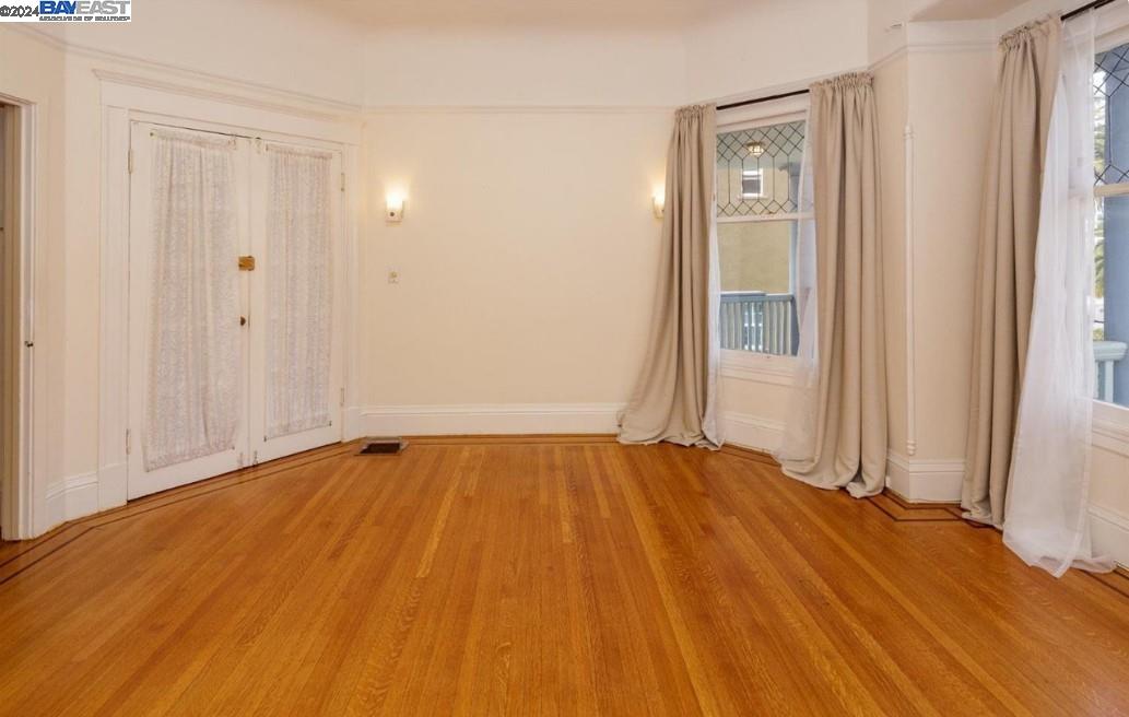 Adams Point Oakland, CA 94610 - Photo 3 of 16 a view of an empty room and wooden floor
