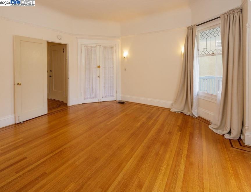 Adams Point Oakland, CA 94610 - Photo 4 of 16 a view of an empty room and wooden floor