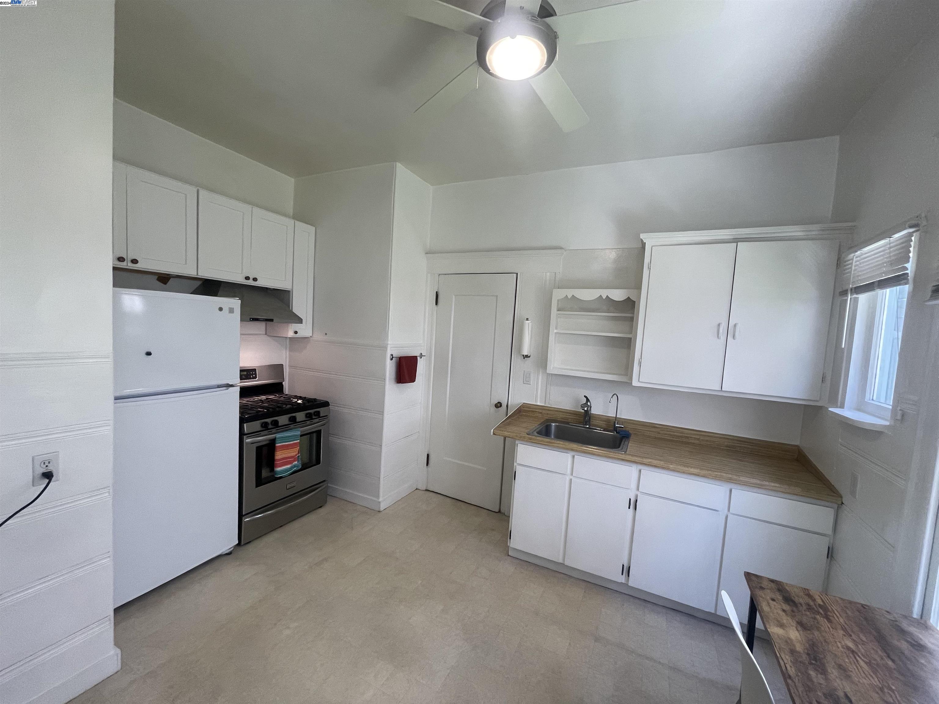Adams Point Oakland, CA 94610 - Photo 9 of 16 a kitchen that has a sink and a stove in it