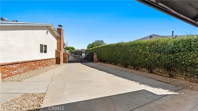 an outdoor space with swimming pool and furniture
