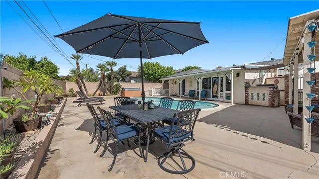 a view of a house with swimming pool and porch