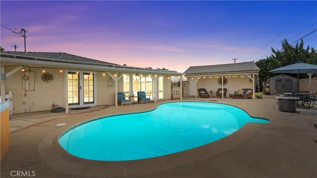 a view of a swimming pool with a patio