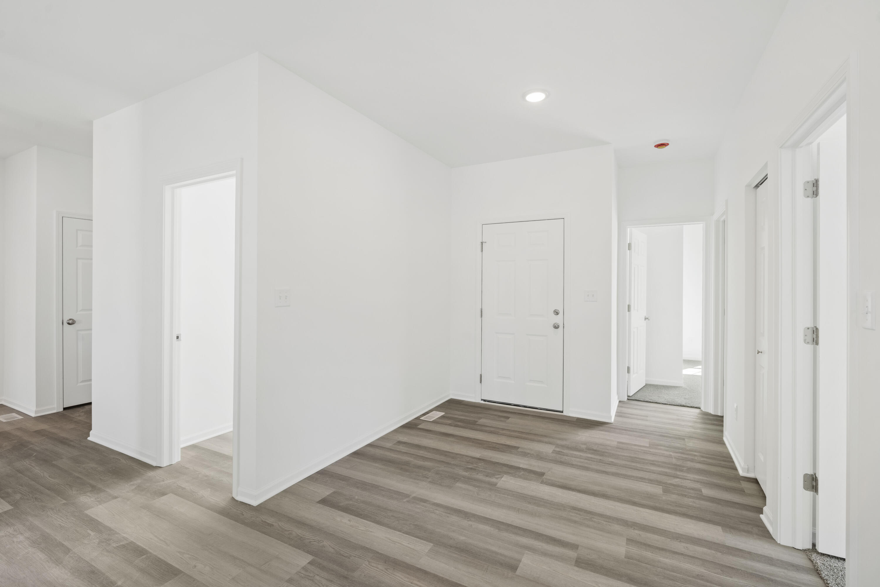 6561 East 103rd Avenue Crown Point, IN 46307 - Photo 2 of 11 a view of a room with wooden floor