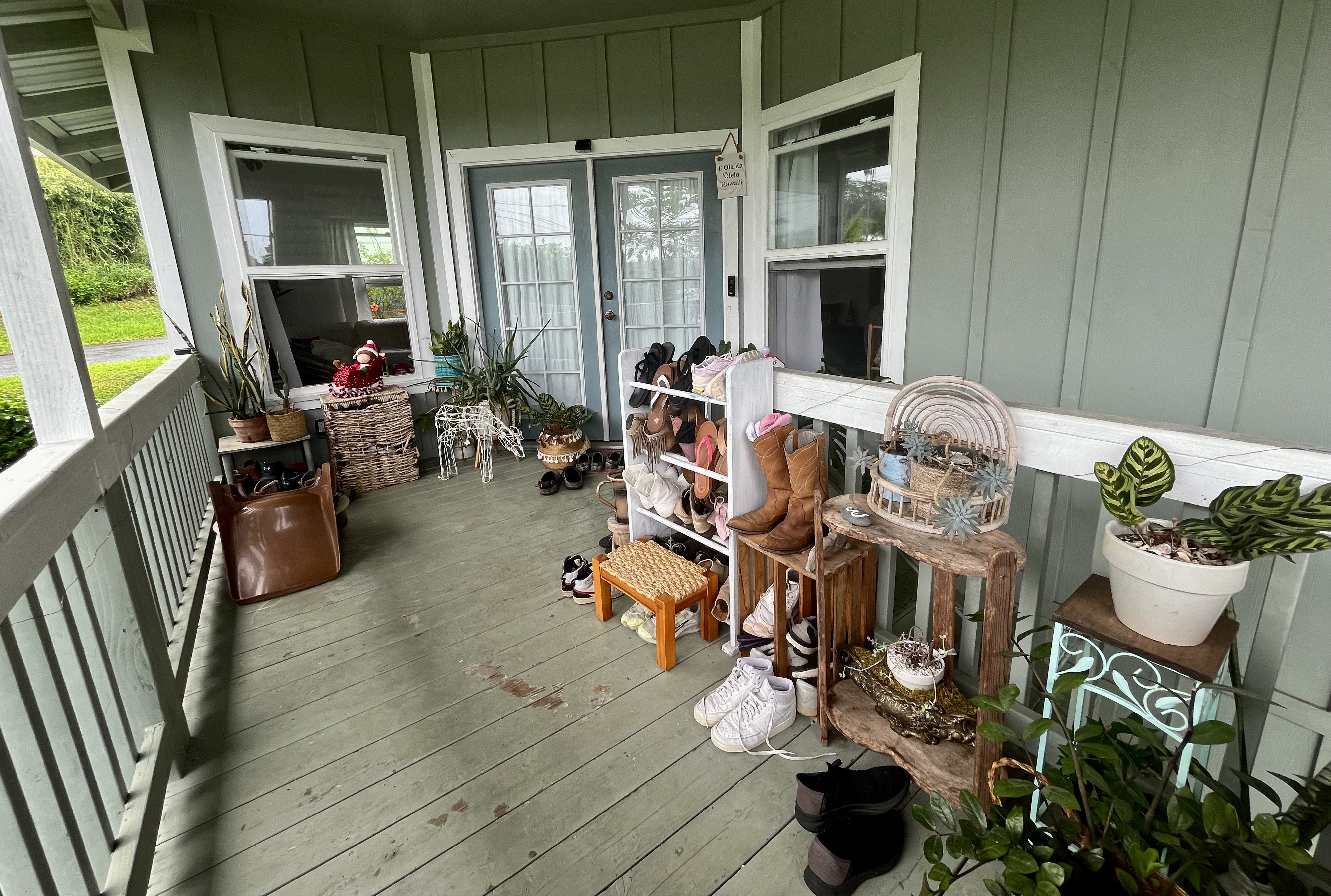 24 Manu Place Hilo, HI 96720 - Photo 3 of 16 a view of a dining room with furniture one side kitchen view and wooden floor