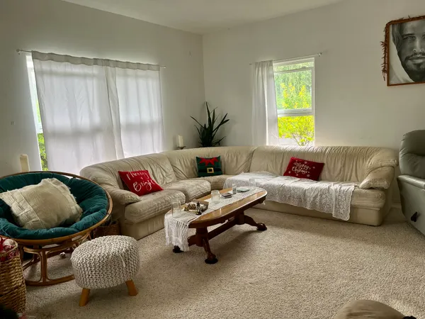 a living room with furniture and a window