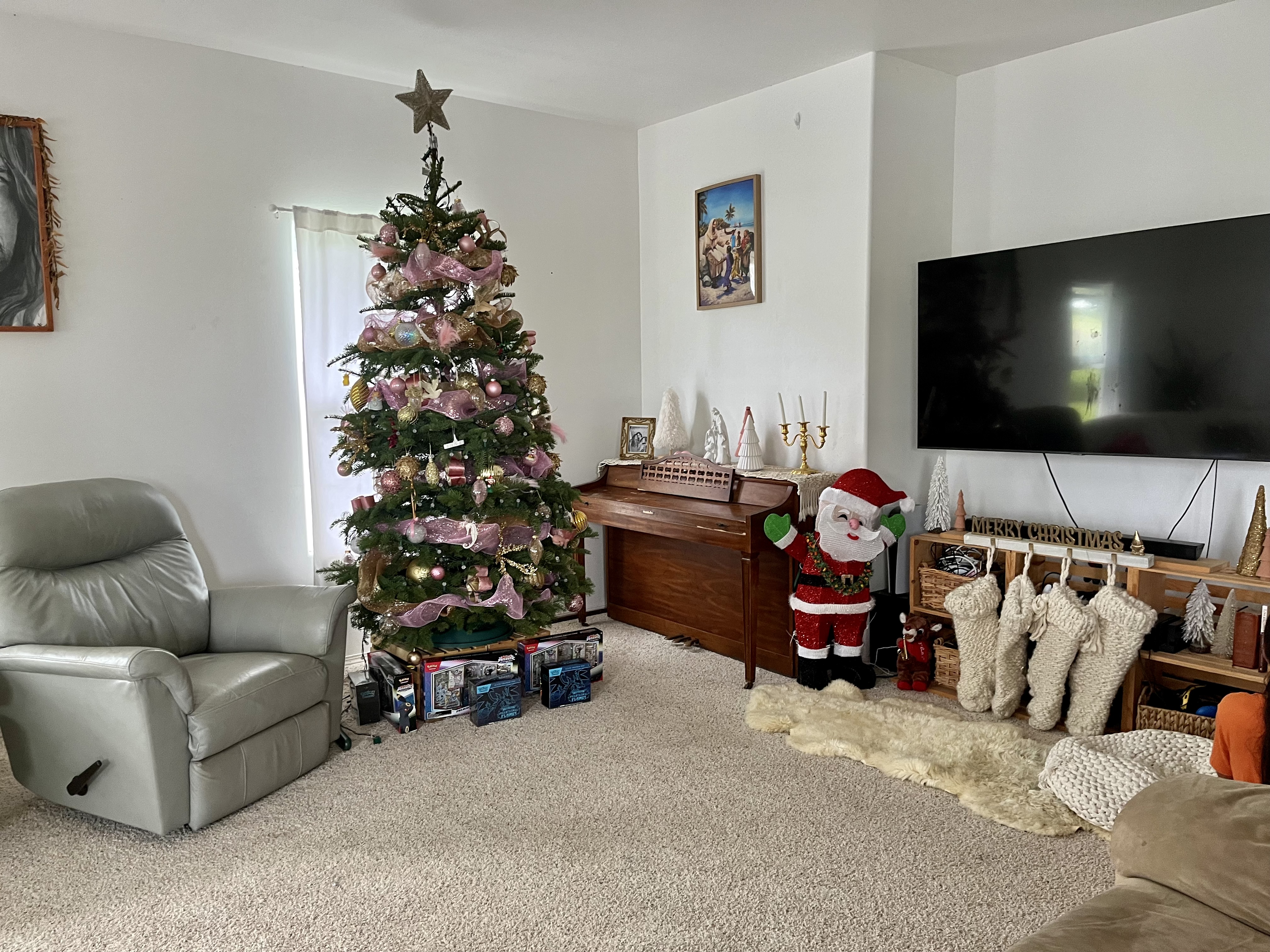 24 Manu Place Hilo, HI 96720 - Photo 5 of 16 a living room with furniture and a flat screen tv