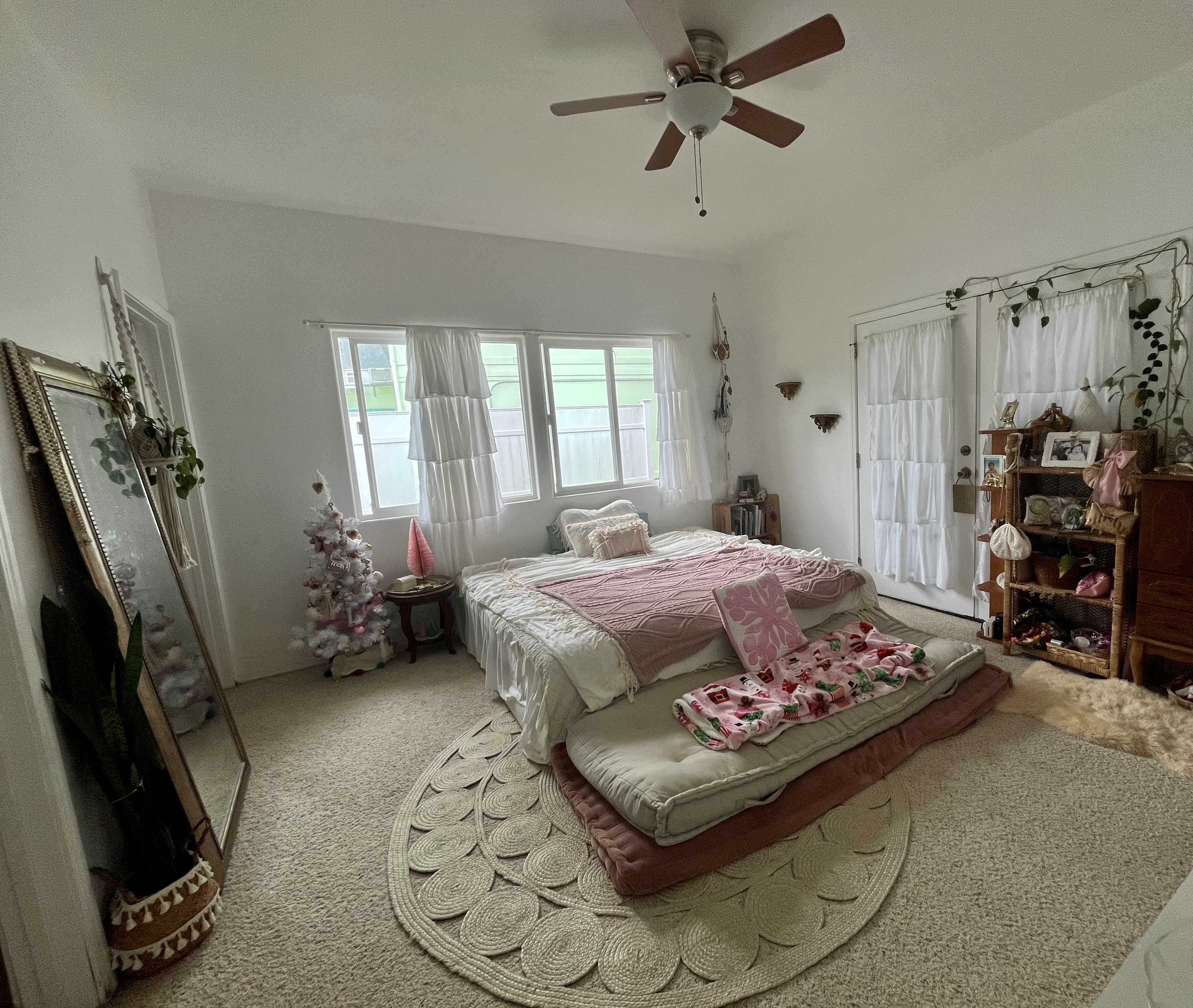 24 Manu Place Hilo, HI 96720 - Photo 7 of 16 a bedroom with a bed and a flat tv screen on the dresser