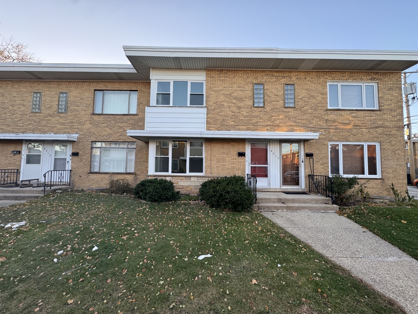 4912 Crain Street, Unit C Skokie, IL 60077 - Photo 1 of 15 a front view of a house with a yard
