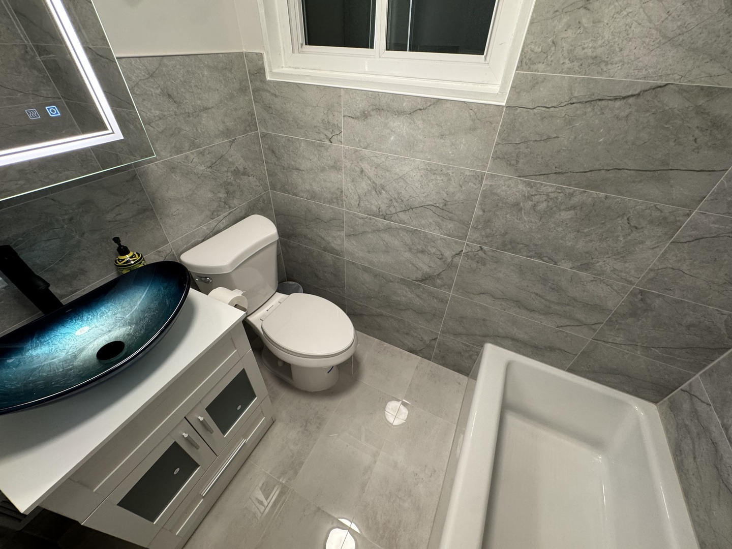 4912 Crain Street, Unit C Skokie, IL 60077 - Photo 7 of 15 a bathroom with a toilet and a sink