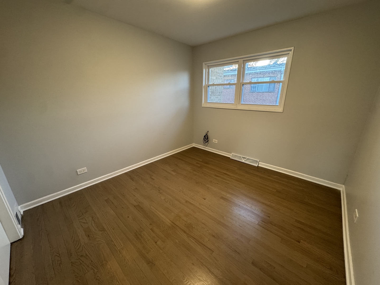 4912 Crain Street, Unit C Skokie, IL 60077 - Photo 9 of 15 an empty room with a window