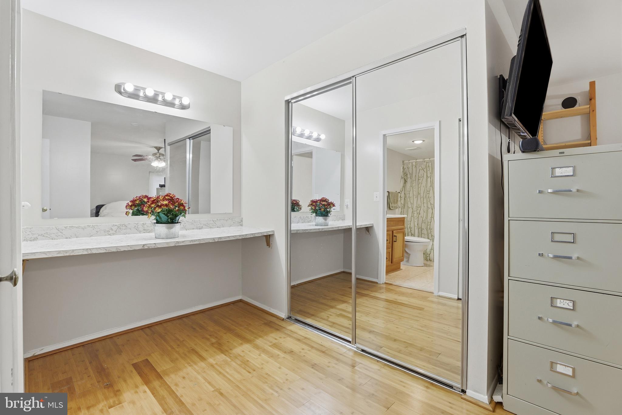 427 Christopher Avenue, Unit T2 Gaithersburg, MD 20879 - Photo 16 of 28 a bathroom with a double vanity sink and mirror