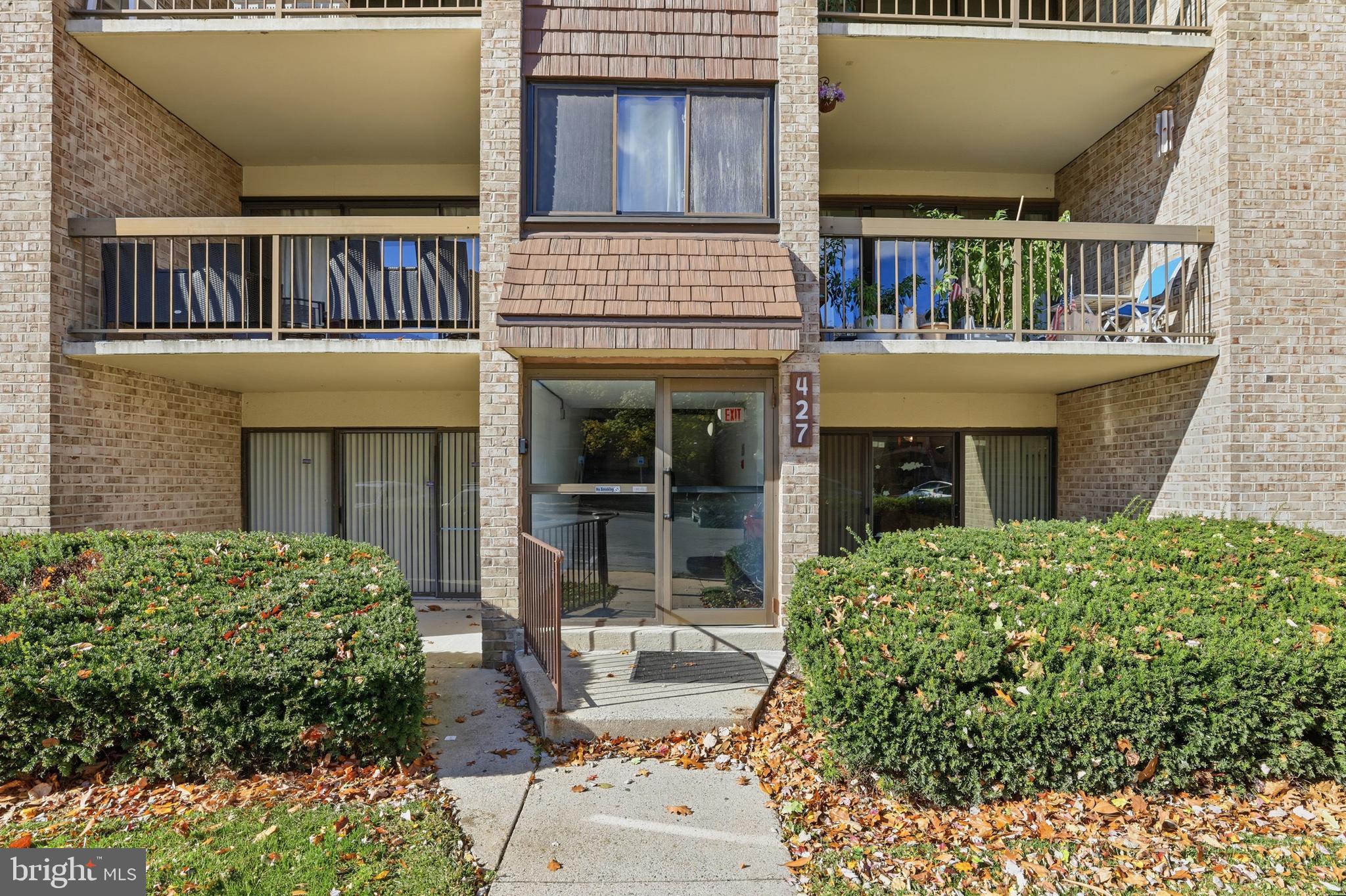 427 Christopher Avenue, Unit T2 Gaithersburg, MD 20879 - Photo 2 of 28 a house view with a garden space