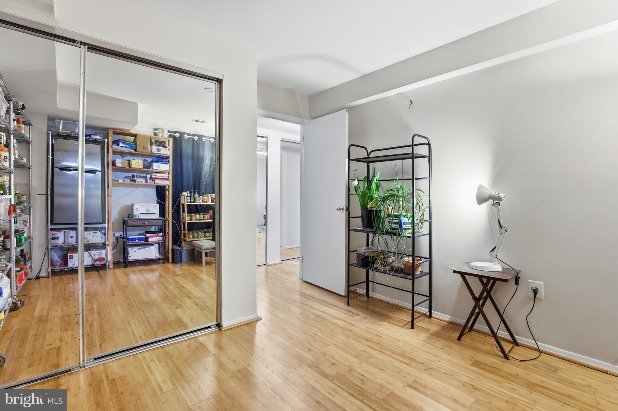 427 Christopher Avenue, Unit T2 Gaithersburg, MD 20879 - Photo 24 of 28 a view of a livingroom with furniture and a bookshelf