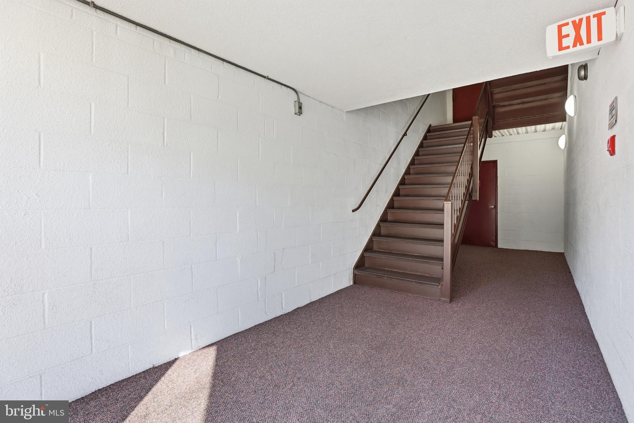 427 Christopher Avenue, Unit T2 Gaithersburg, MD 20879 - Photo 4 of 28 a view of a hallway with stairs