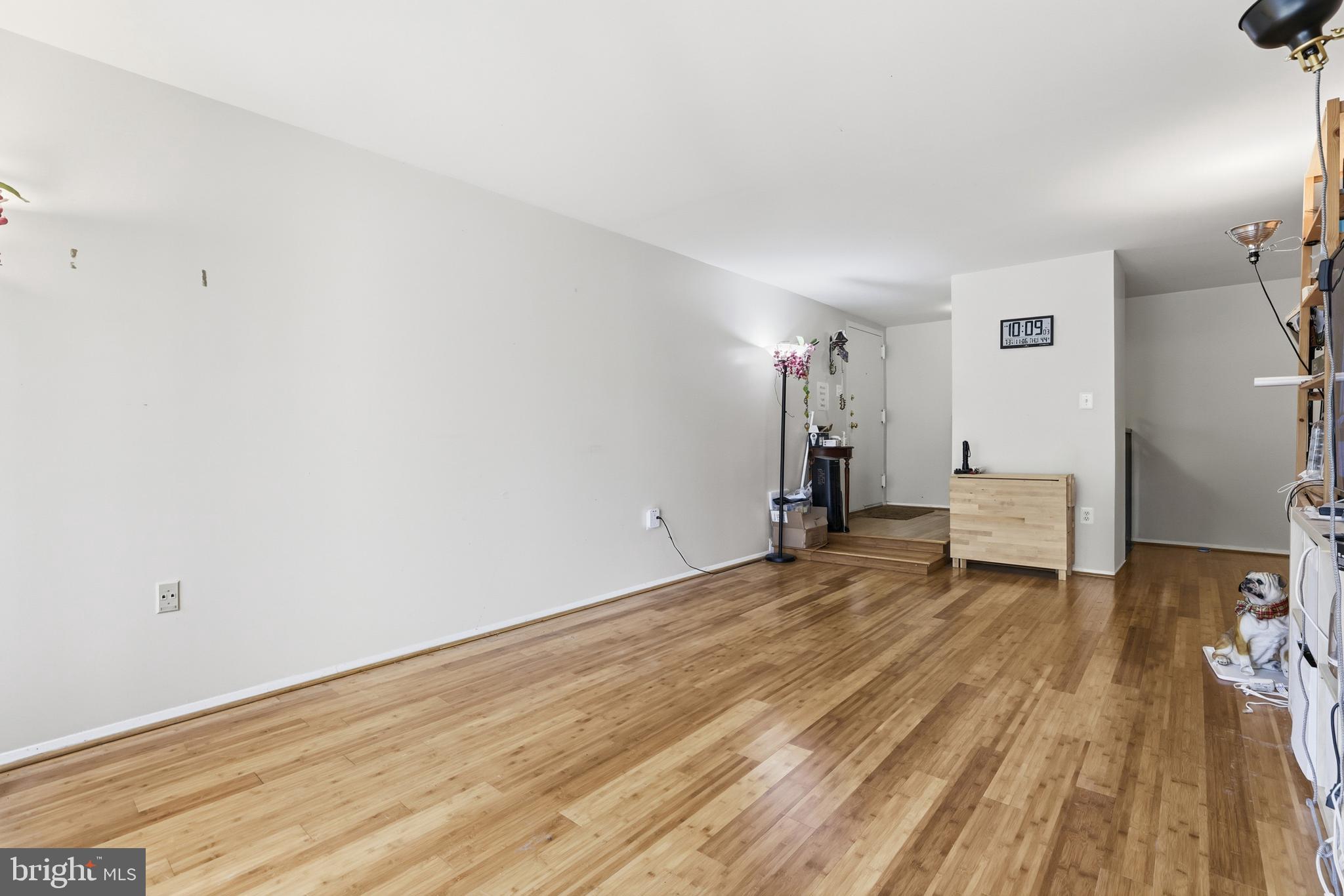427 Christopher Avenue, Unit T2 Gaithersburg, MD 20879 - Photo 7 of 28 a view of empty room with wooden floor