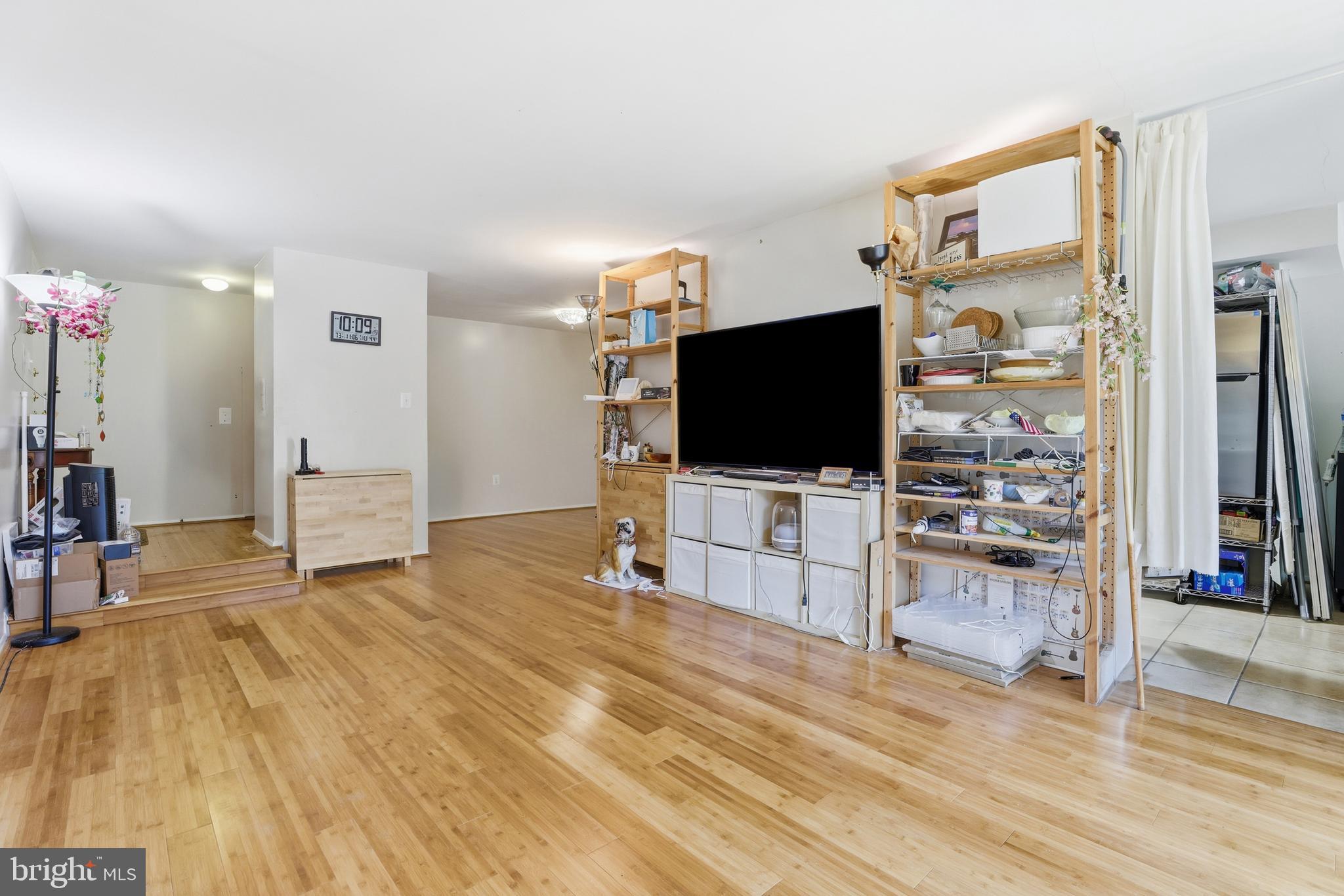 427 Christopher Avenue, Unit T2 Gaithersburg, MD 20879 - Photo 9 of 28 a living room with furniture and a flat screen tv