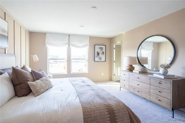 a bedroom with a large bed and a dresser