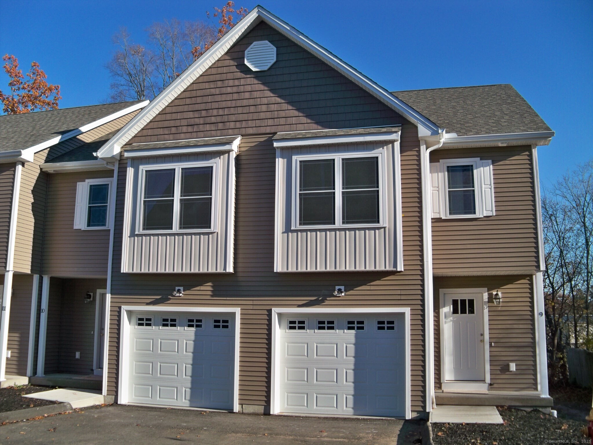 404 Main Street, Unit 13 Wallingford, CT 06492 - Photo 1 of 19 a view of a house with wooden fence