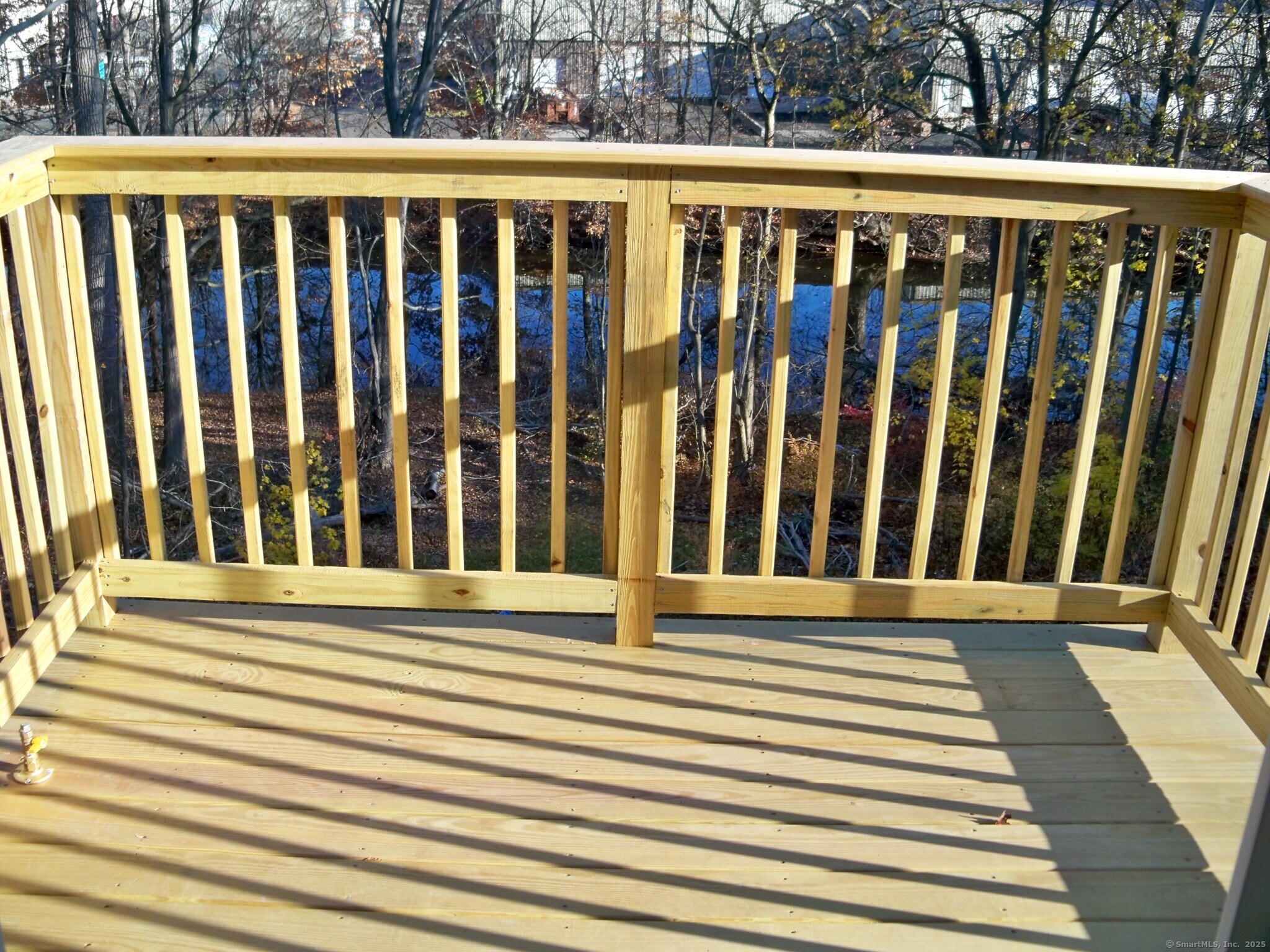 404 Main Street, Unit 13 Wallingford, CT 06492 - Photo 18 of 19 a view of wooden balcony