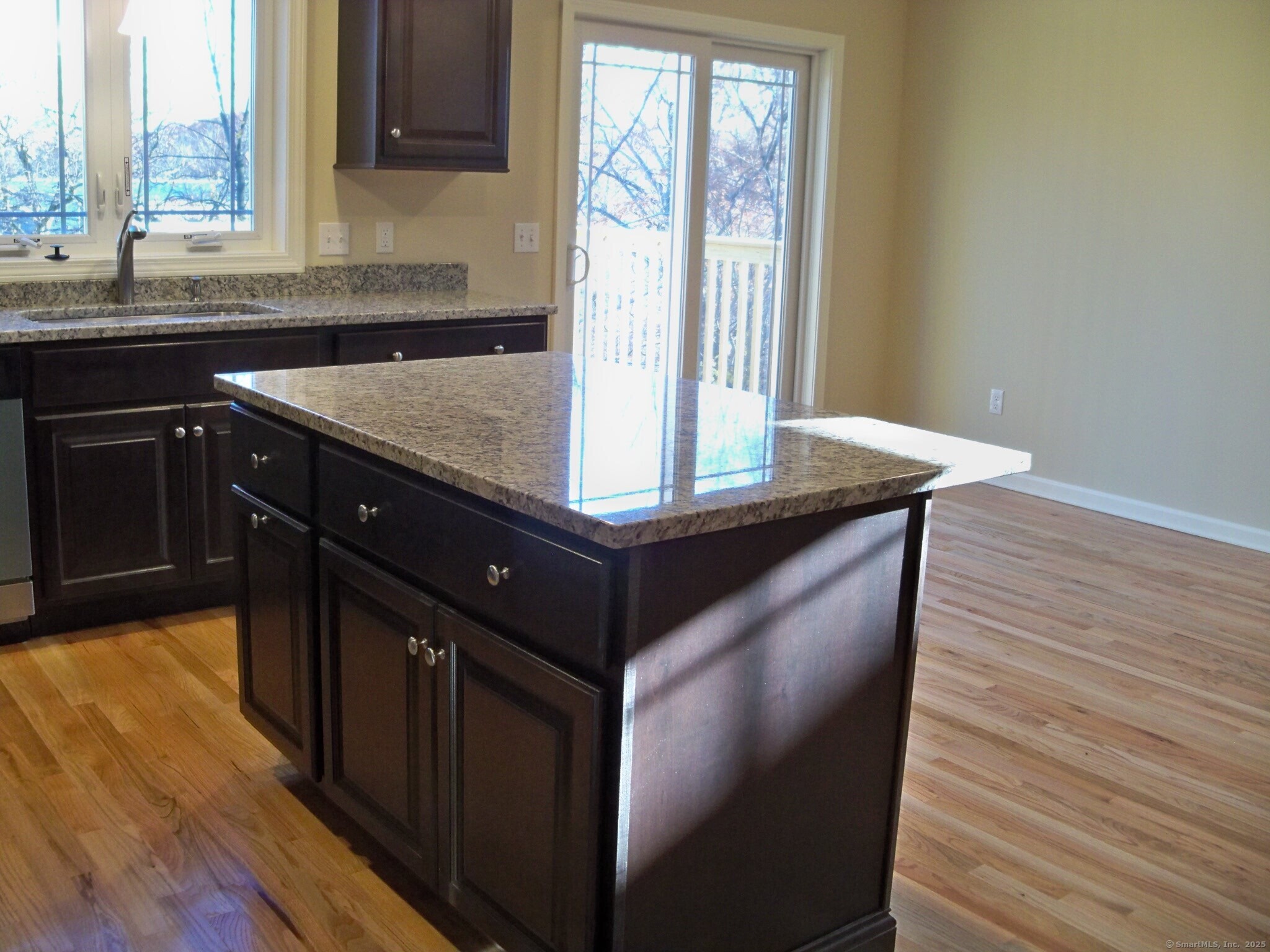 404 Main Street, Unit 13 Wallingford, CT 06492 - Photo 4 of 19 a kitchen with a sink window and cabinets