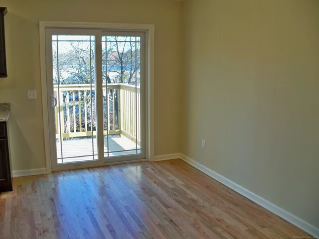 a view of wooden floor and brick walls