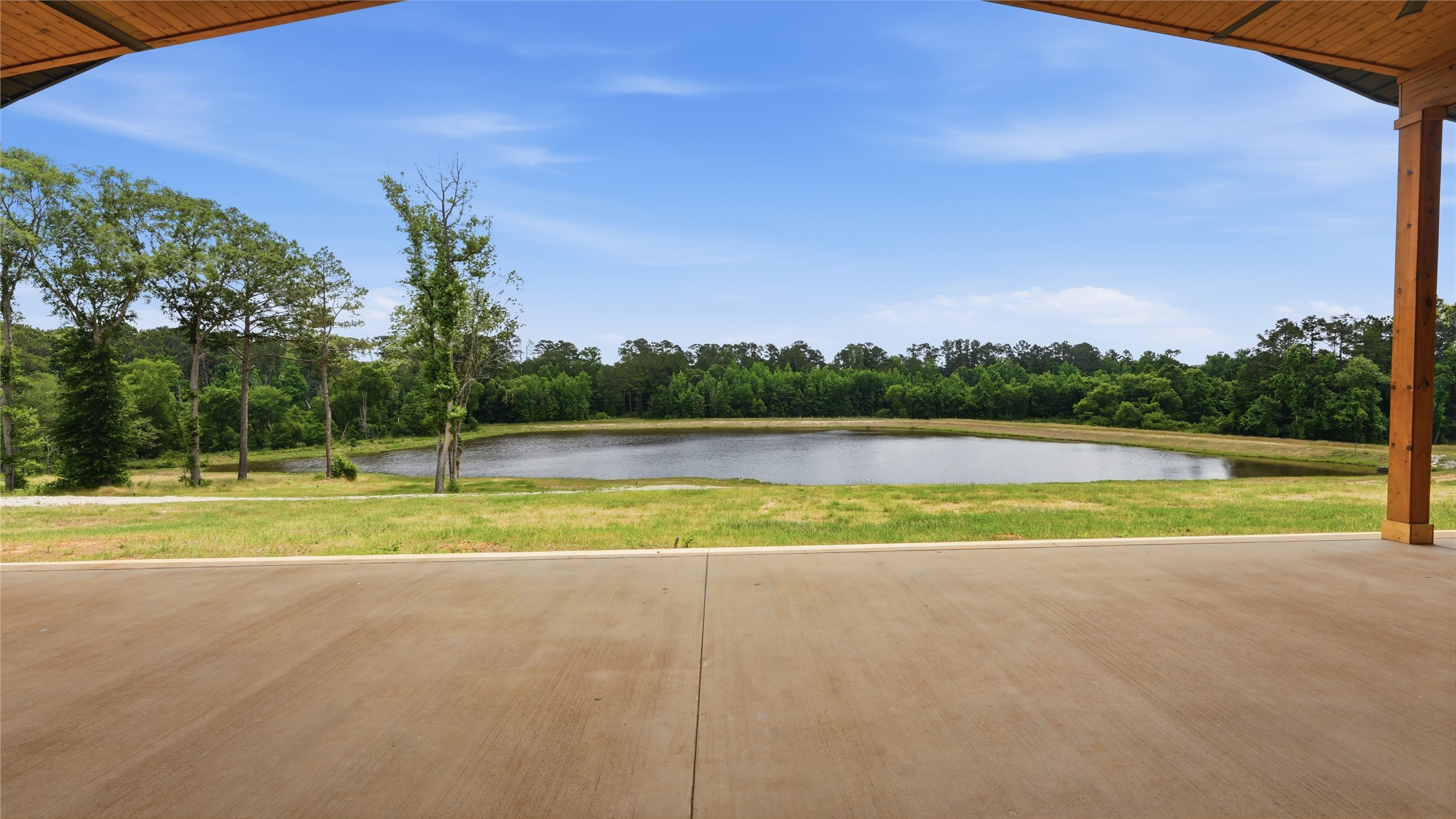 447 County Road 2211 Rusk, TX 75785 - Photo 25 of 50 a view of a swimming pool with a yard and trees