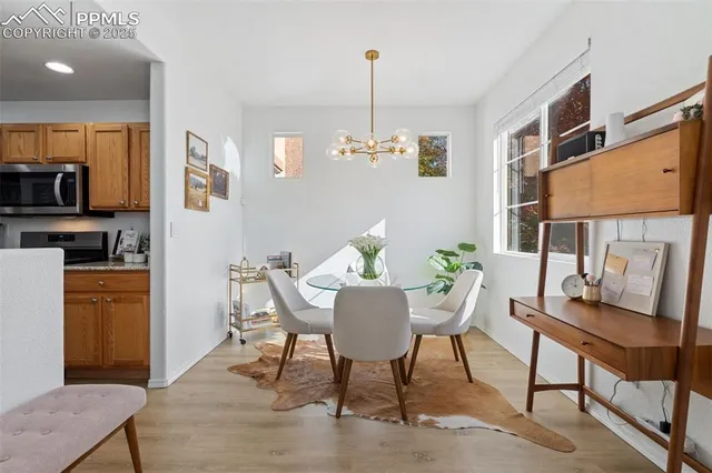 a view of a dining room with furniture window and wooden floor
