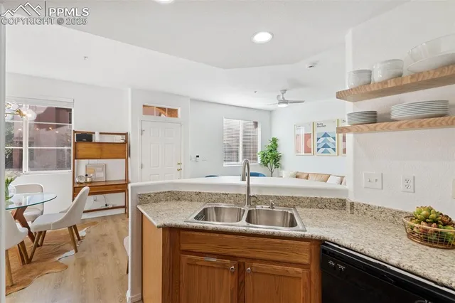 a kitchen with a sink and cabinets