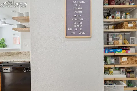 a shelf with books and knick knacks on it