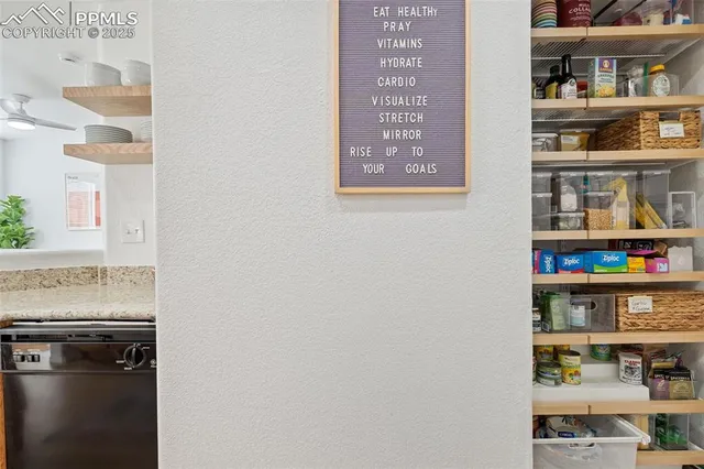 a shelf with books and knick knacks on it