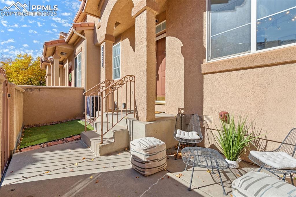 3231 Apogee View Colorado Springs, CO 80906 - Photo 2 of 38 a front view of a house with outdoor seating and plants