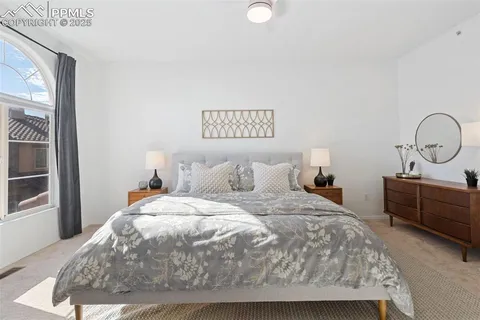 a bedroom with bed and window