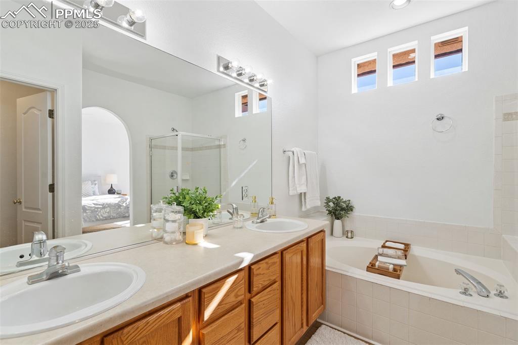 3231 Apogee View Colorado Springs, CO 80906 - Photo 27 of 38 a bathroom with a sink and a mirror