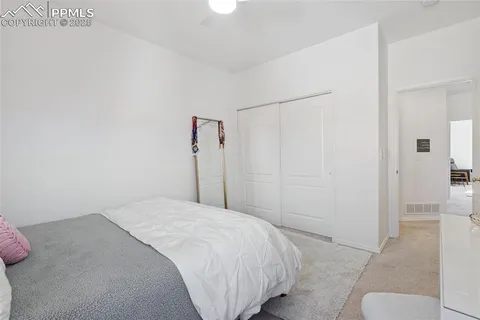 a bedroom with a bed and a shower